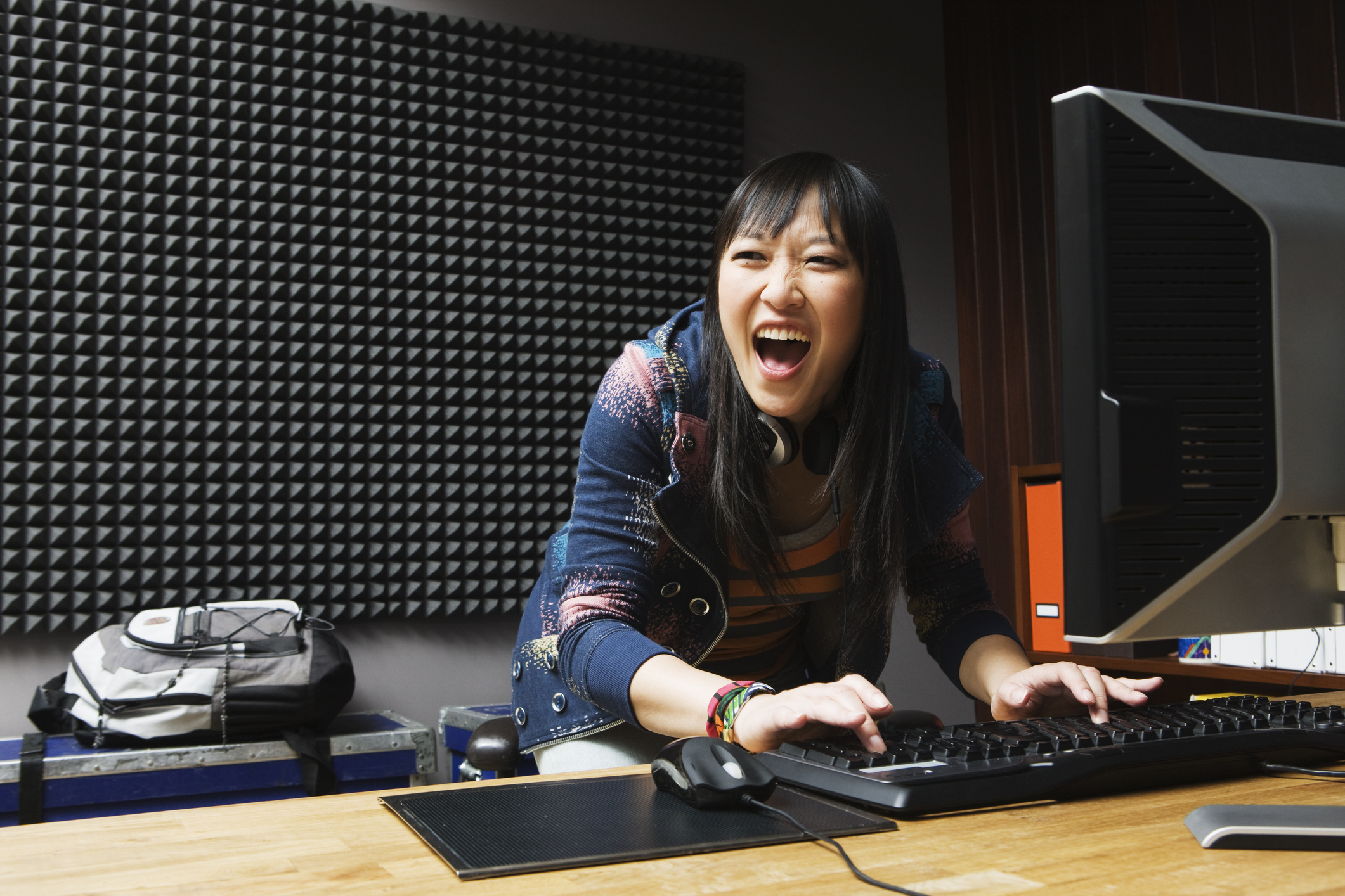 girl playing games on desktop computer